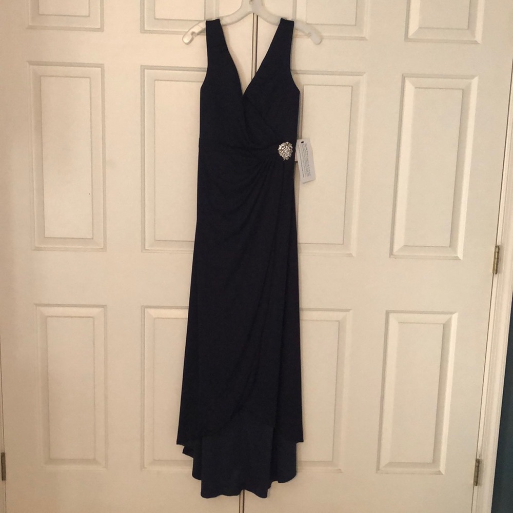 Never been worn tags on formal dress. Dark purple